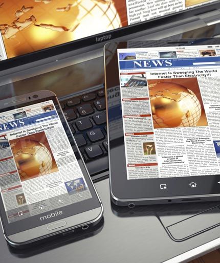 news headlines on mobile phone, tablet and laptop